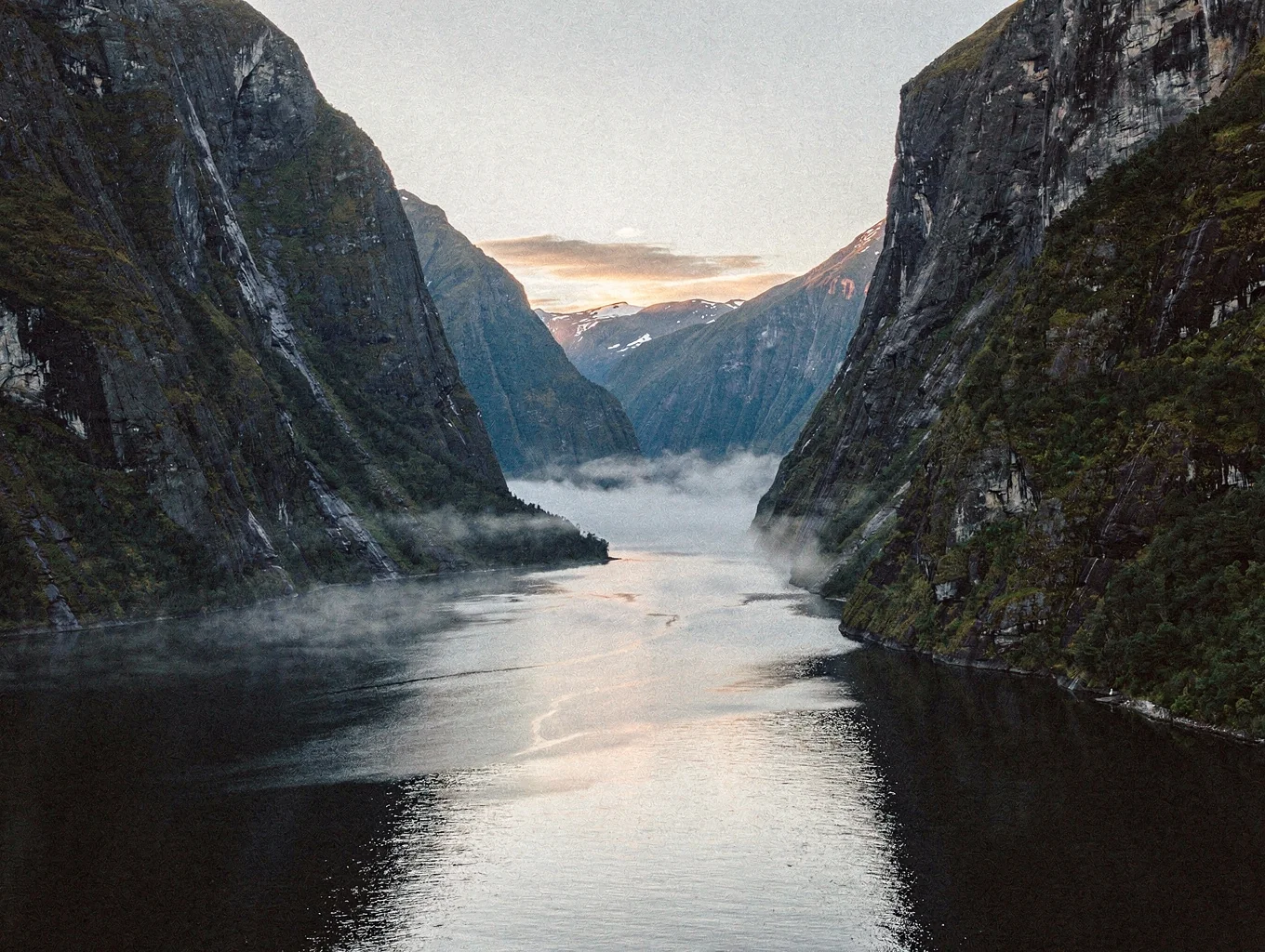 Misty fjord and towering peaks in New Zealand