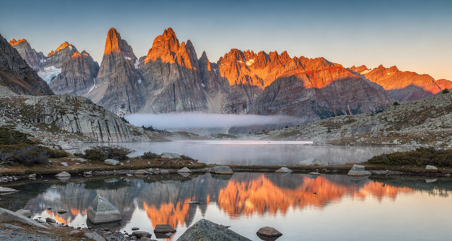 Jagged granite peaks illuminated by soft morning light